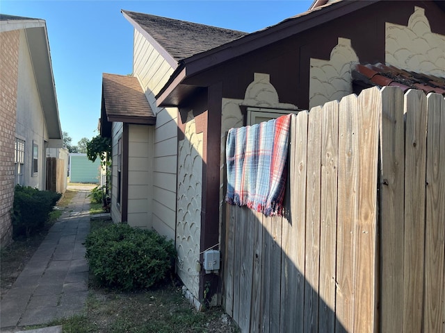 12331 W Village Dr Unit D, Houston, TX 77039 - view of side of property featuring a shingled roof