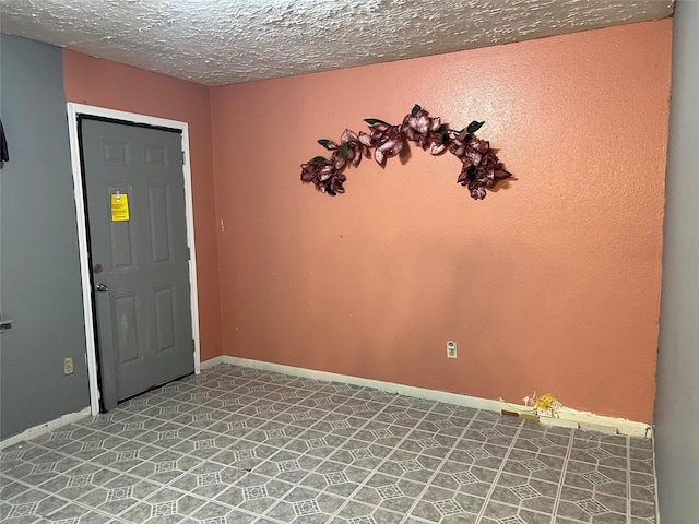 foyer with a textured ceiling