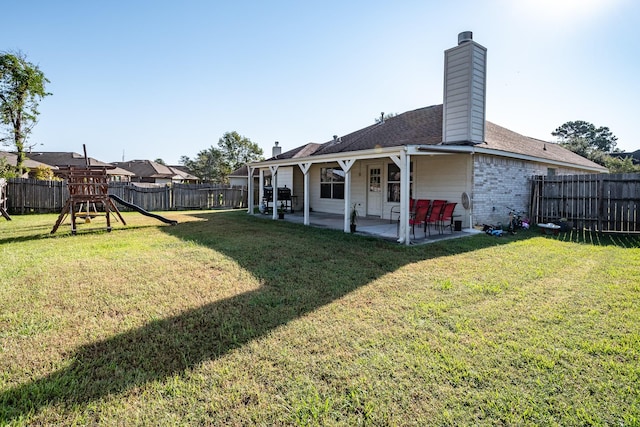 view of yard featuring a patio area and a playground