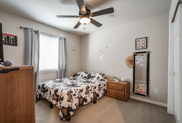 bedroom featuring light colored carpet and ceiling fan