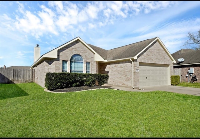 single story home with a front yard and a garage