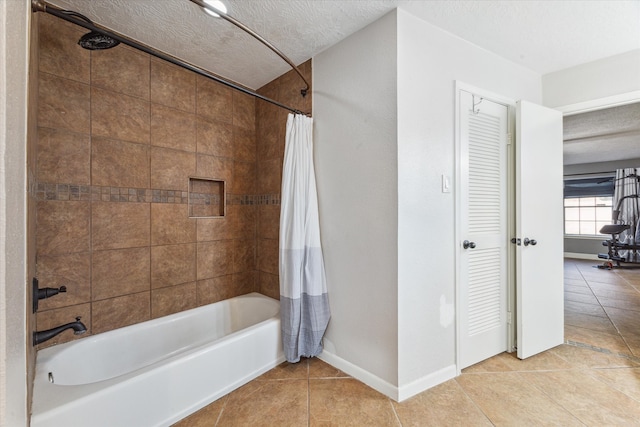 bathroom with a textured ceiling, shower / bathtub combination with curtain, and tile patterned floors