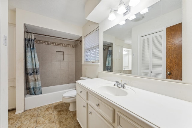 full bathroom featuring tile patterned floors, vanity, shower / bath combo with shower curtain, and toilet