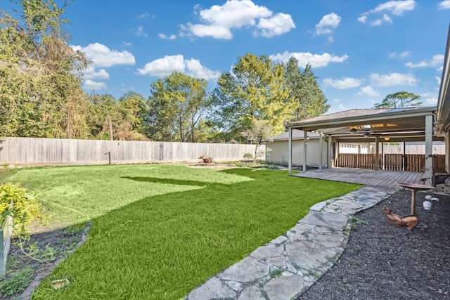 view of yard featuring a patio area and ceiling fan