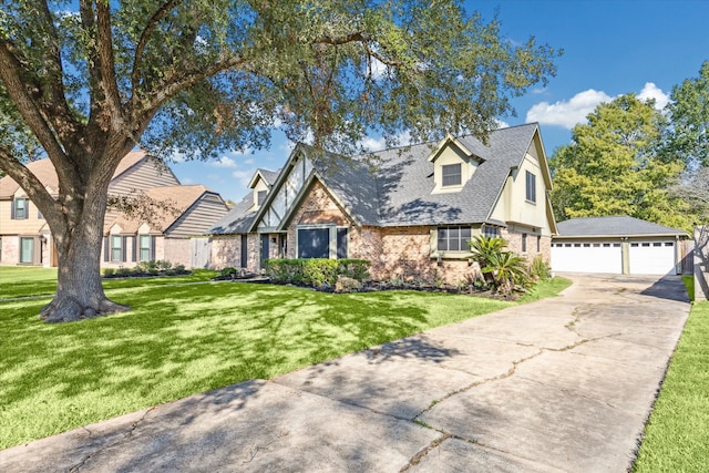 view of front of house featuring a garage and a front lawn