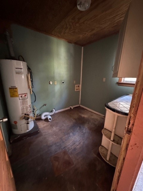 washroom with gas water heater and hardwood / wood-style floors