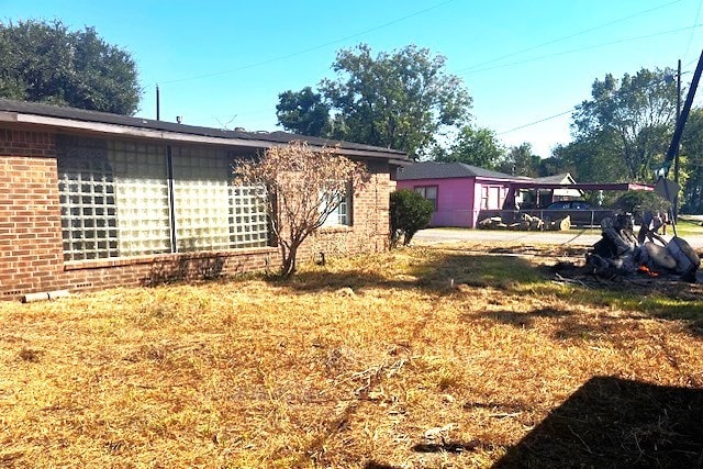 view of home's exterior with a yard