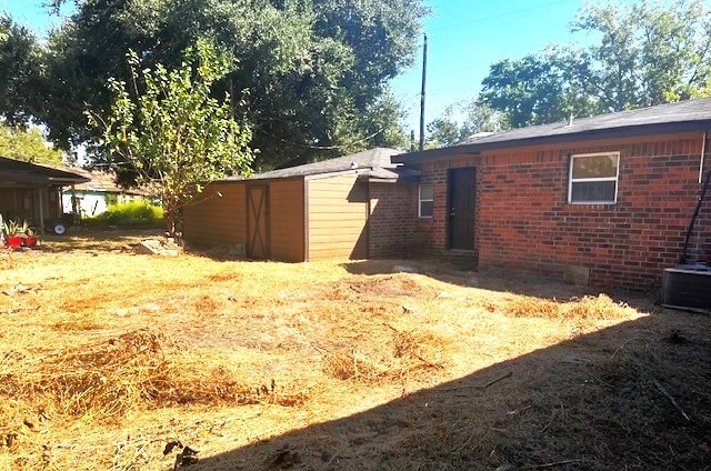 view of side of property featuring central air condition unit