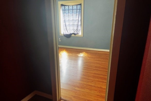 unfurnished room with light hardwood / wood-style floors