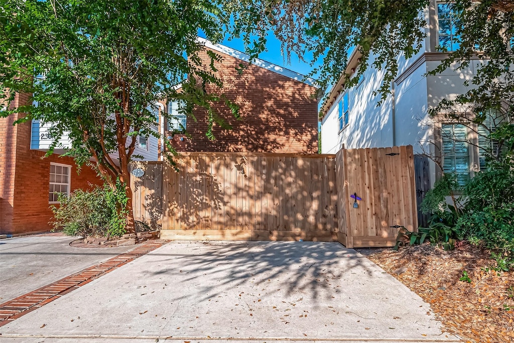 2300 Driscoll, Houston, TX 77019 - view of home's exterior featuring a patio and fence