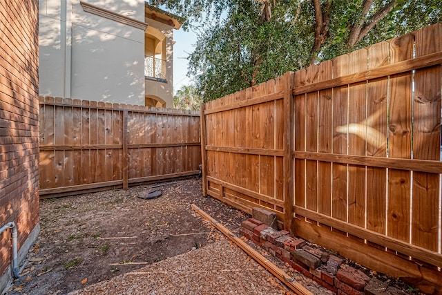 view of yard with a balcony