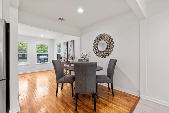 dining area featuring light wood-type flooring