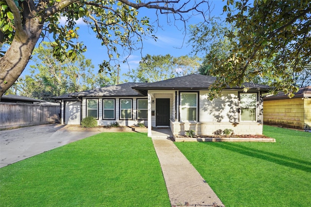 ranch-style home with a front yard