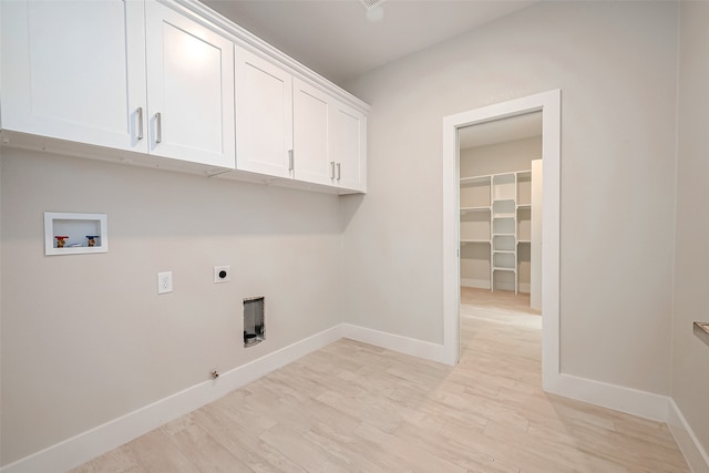 clothes washing area featuring hookup for a washing machine, light hardwood / wood-style flooring, cabinets, and hookup for an electric dryer