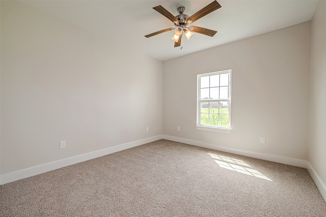 carpeted empty room with ceiling fan