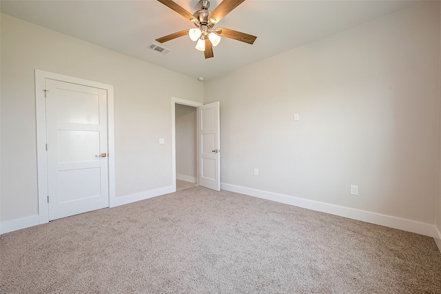 empty room with carpet flooring and ceiling fan