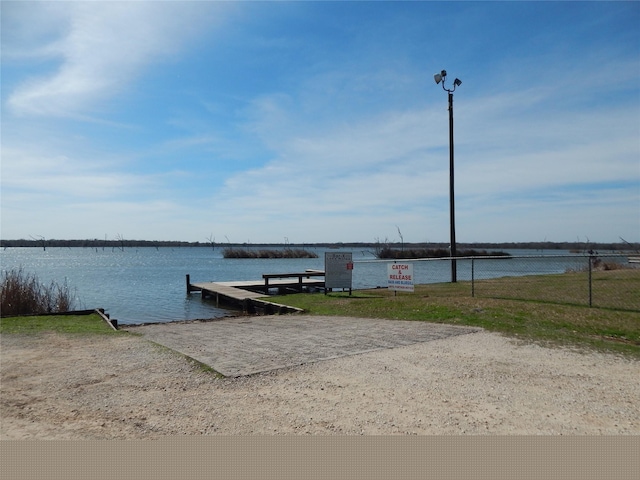 dock area featuring a water view