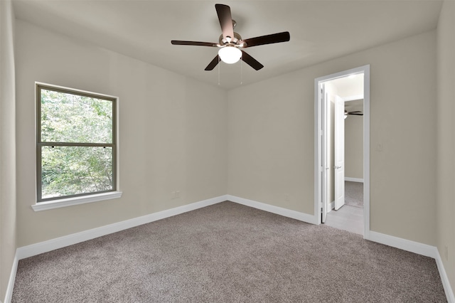 unfurnished room with light carpet and ceiling fan