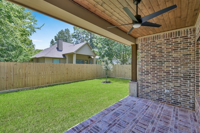 view of yard featuring a patio and ceiling fan