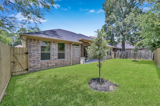 rear view of house featuring a lawn