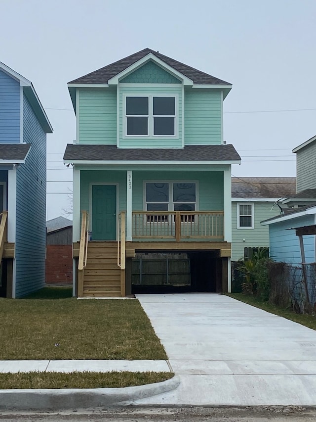 view of front of property with covered porch and a front lawn