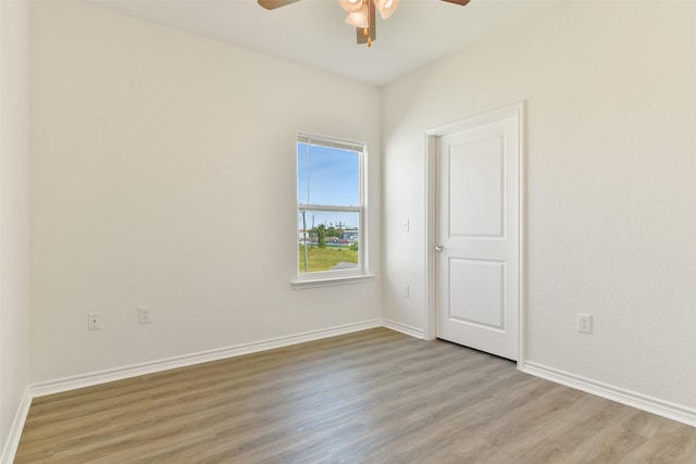 spare room featuring ceiling fan and light hardwood / wood-style flooring