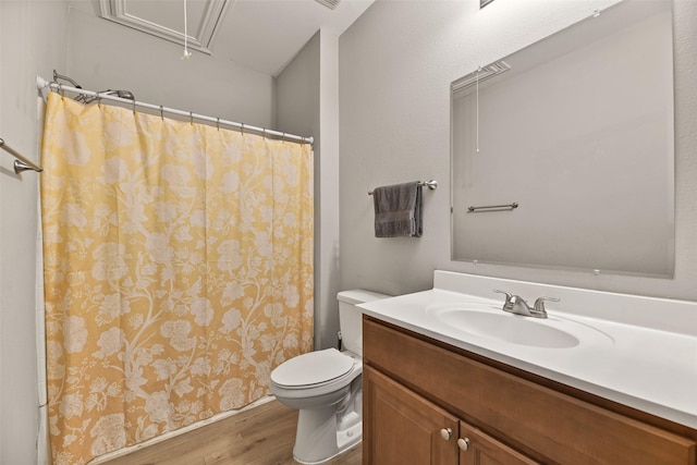 bathroom featuring toilet, a shower with curtain, vanity, and hardwood / wood-style floors