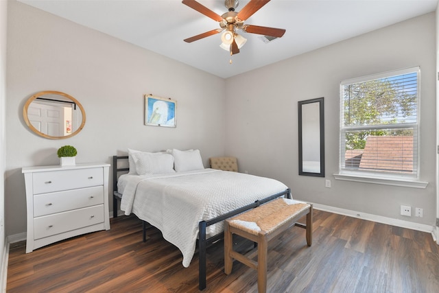 bedroom featuring dark hardwood / wood-style flooring and ceiling fan