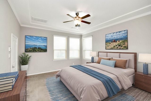 carpeted bedroom with ceiling fan and crown molding