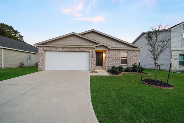 view of front of house with a front yard and a garage