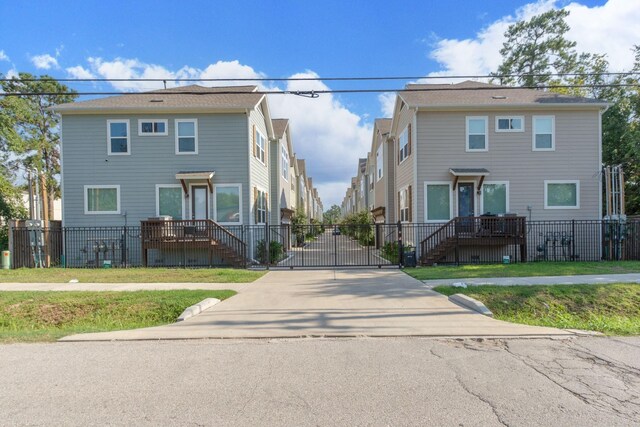 3344 Pinemont Dr, Houston, TX 77018 - view of concrete driveway featuring a gate and a gated entry