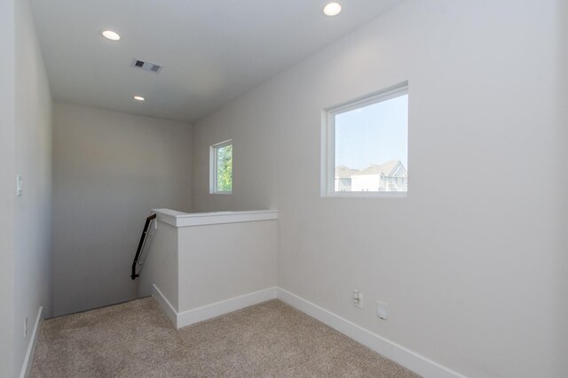 3344 Pinemont Dr, Houston, TX 77018 - empty room with light colored carpet and recessed lighting