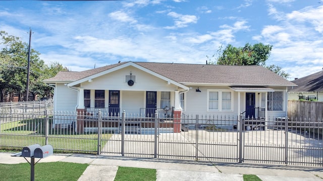 ranch-style house with a front yard and a porch