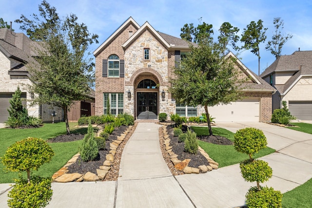 view of front facade with french doors and a garage