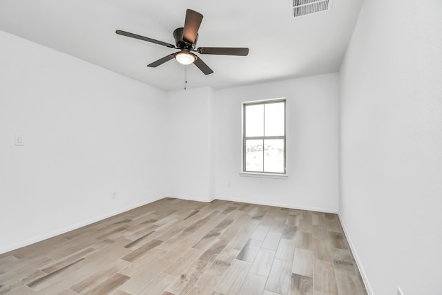 spare room with light hardwood / wood-style flooring and ceiling fan