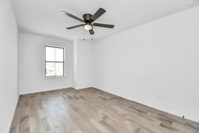 unfurnished room with light wood-type flooring and ceiling fan