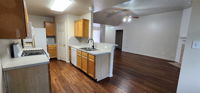 kitchen featuring white appliances, sink, backsplash, dark hardwood / wood-style flooring, and ceiling fan