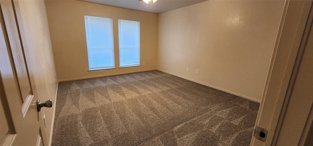 carpeted empty room featuring ceiling fan