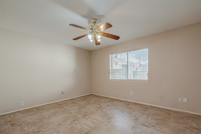 spare room with ceiling fan