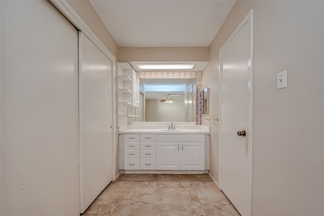 bathroom with ceiling fan and vanity