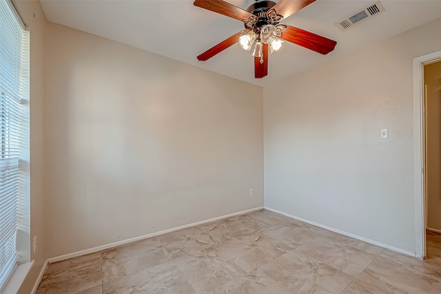 spare room with ceiling fan