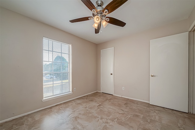 spare room featuring ceiling fan