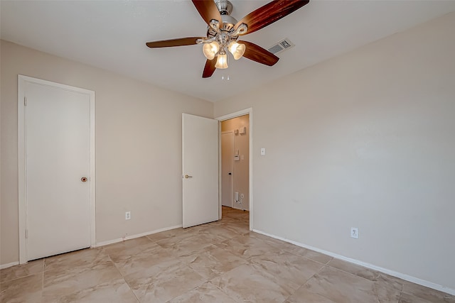 unfurnished bedroom featuring ceiling fan