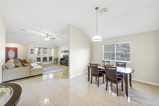 dining area with lofted ceiling and ceiling fan