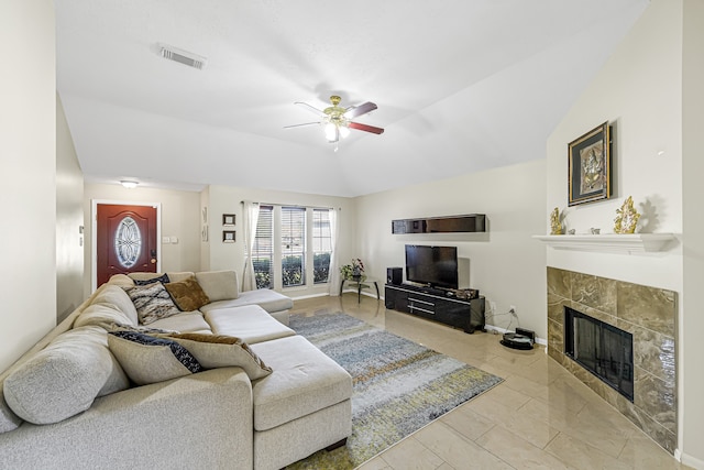 living room with lofted ceiling, a fireplace, and ceiling fan