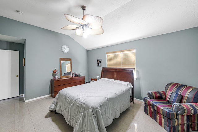 bedroom with lofted ceiling, light tile patterned floors, and ceiling fan