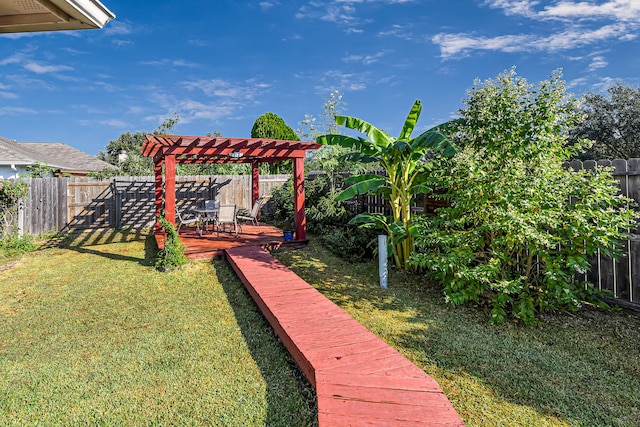 view of yard with a wooden deck and a pergola