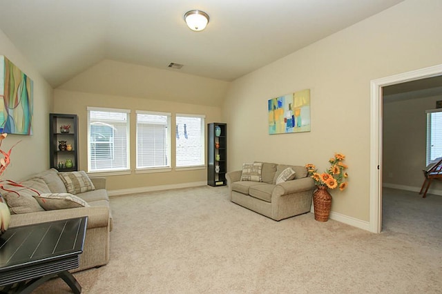 27827 Ramble Rock Ct, Katy, TX 77494 - carpeted living area with lofted ceiling, plenty of natural light, and baseboards