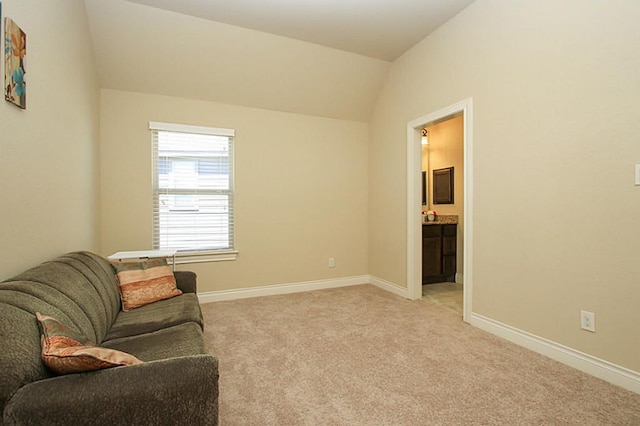 27827 Ramble Rock Ct, Katy, TX 77494 - living area featuring light carpet, vaulted ceiling, and baseboards
