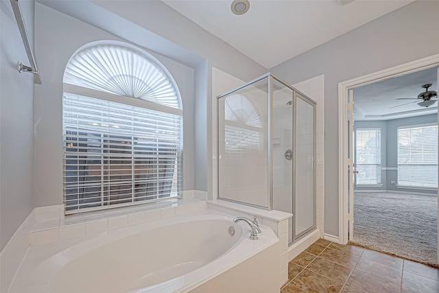 bathroom featuring tile patterned floors, ceiling fan, and shower with separate bathtub